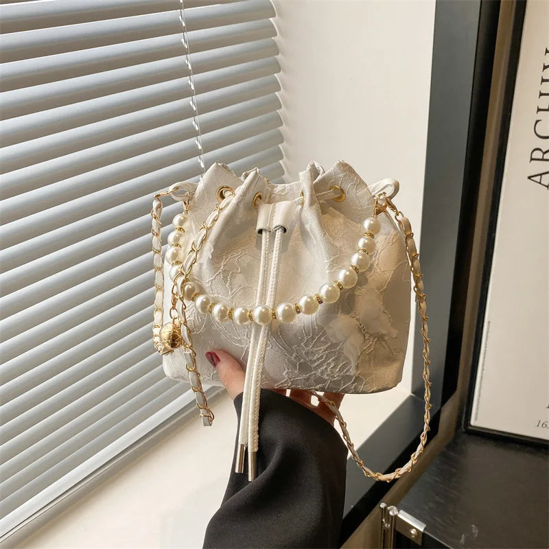 Women's butterfly bucket shoulder bag by MAIRA'S COLLECTIONS with floral butterfly design and adjustable shoulder strap