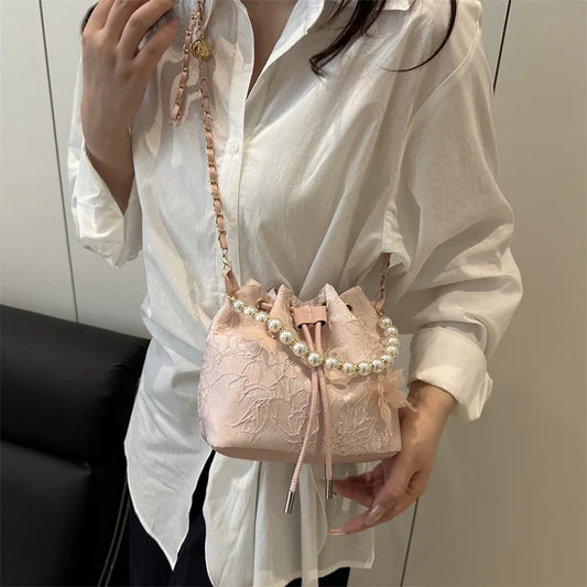 Women's butterfly bucket shoulder bag by MAIRA'S COLLECTIONS featuring a stylish butterfly design and adjustable shoulder strap.