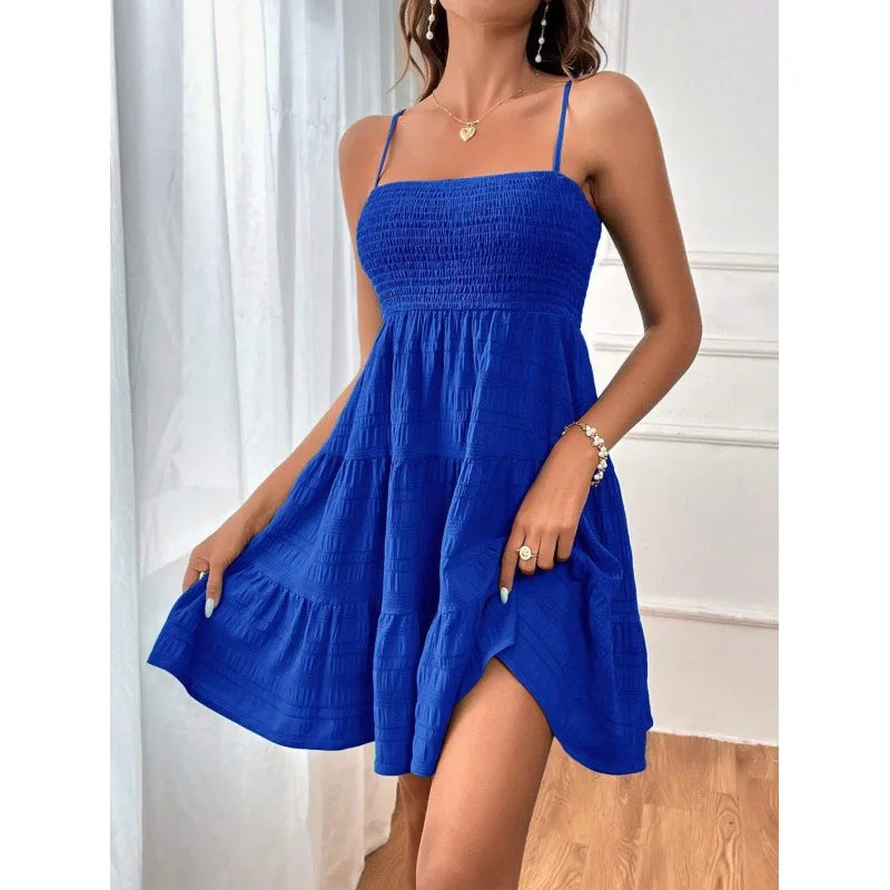 Women's smocked mini dress by MAIRA'S COLLECTIONS featuring a fitted bodice and ruffled hem, perfect for casual or summer wear.