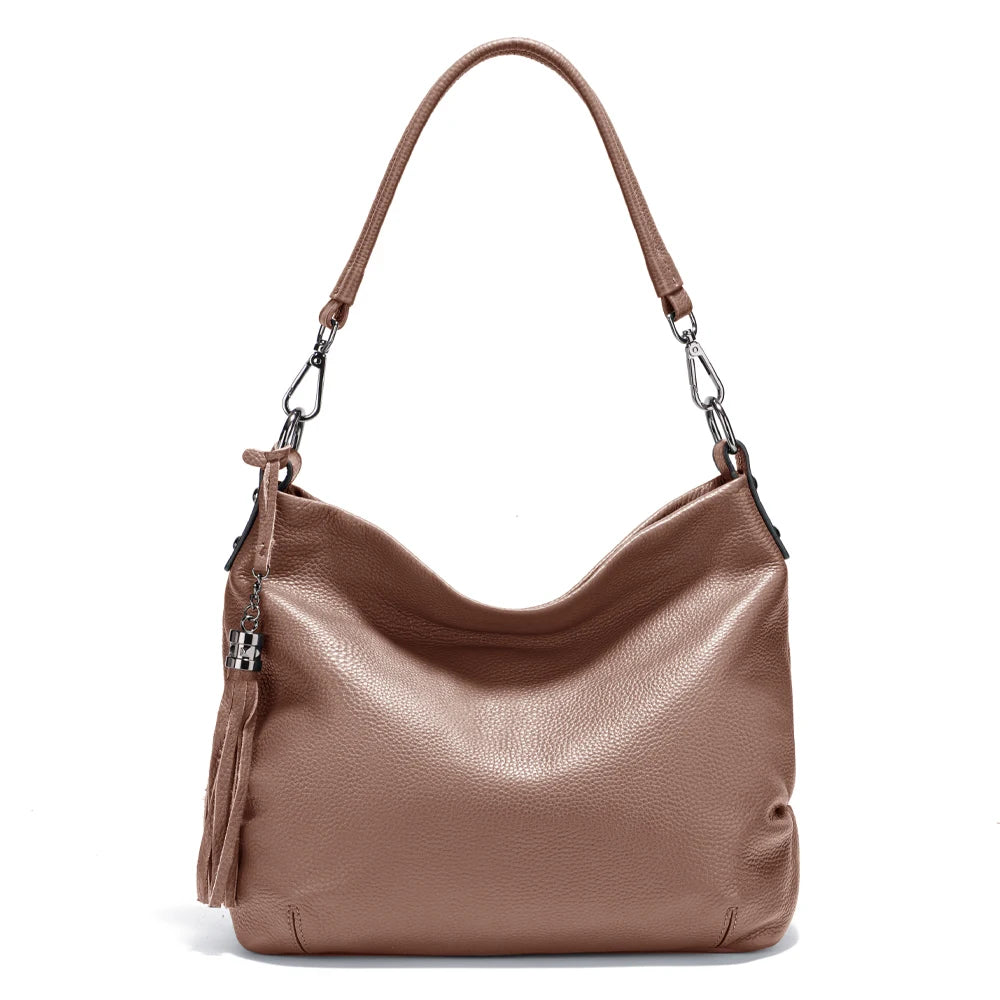 Zency cowhide leather shoulder bag by MAIRA'S COLLECTIONS with adjustable strap and minimalist design, front view.