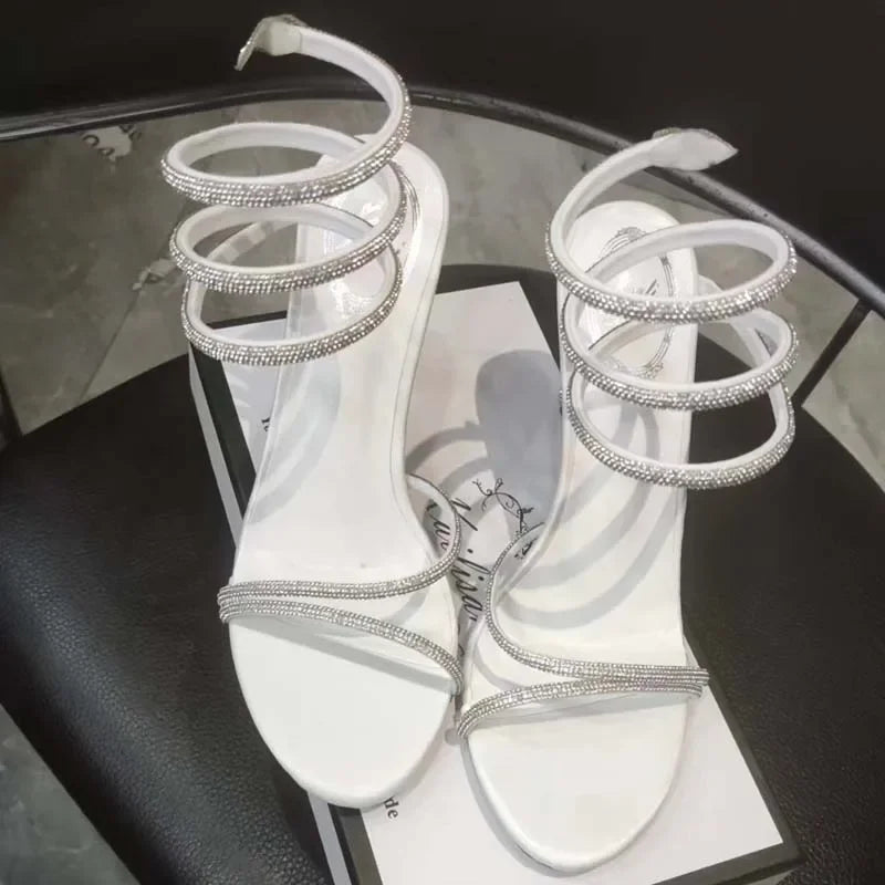 Elegant Eilyken Crystal Ankle Strap High Heel Sandals by MAIRA'S COLLECTIONS with sparkling crystal details and a sleek design.