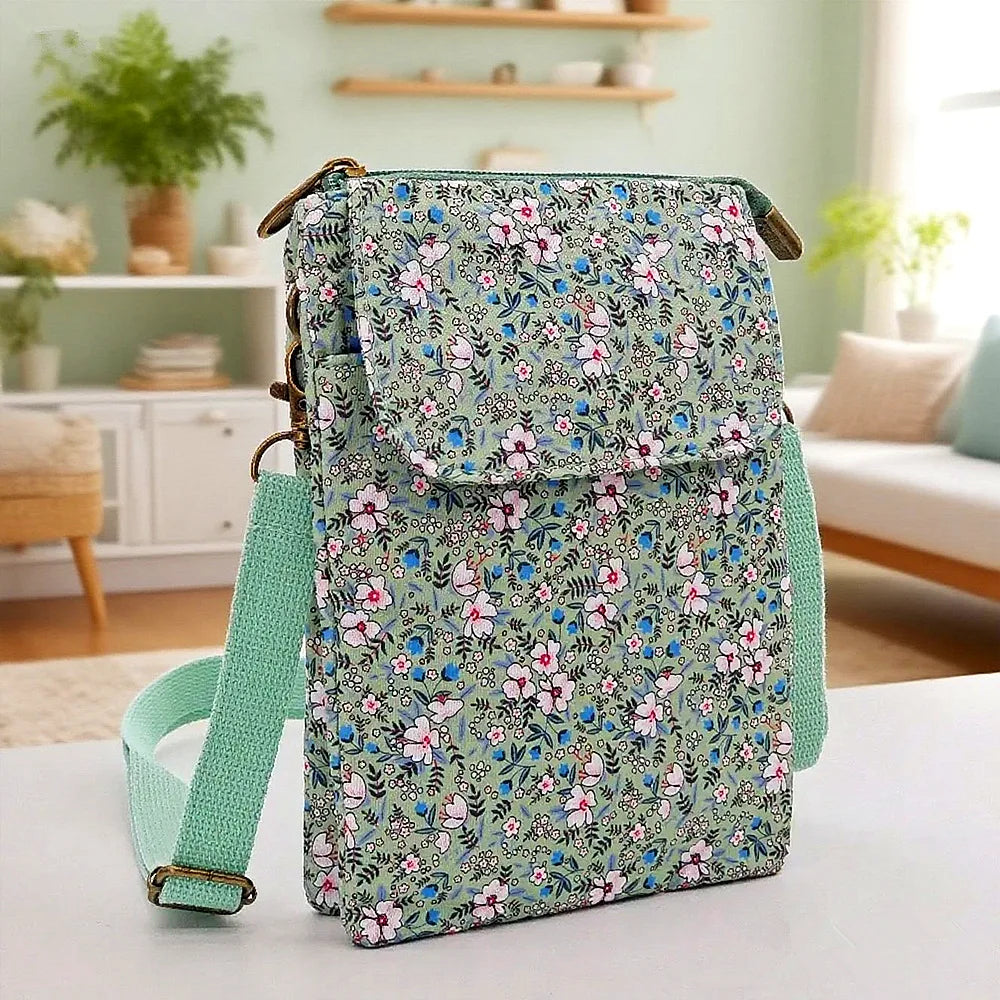 Women's printed crossbody phone bag by MAIRA'S COLLECTIONS with colorful floral design and adjustable strap.