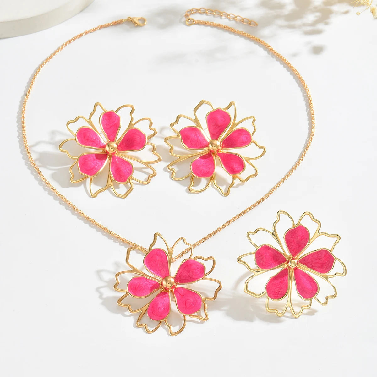 Bohemian floral jewelry set featuring earrings and necklace with colorful floral designs from MAIRA'S COLLECTIONS.