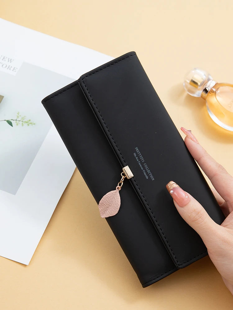 Women's PU leather tri-fold bag by MAIRA'S COLLECTIONS, showing the stylish brown leather exterior and multiple fold details.