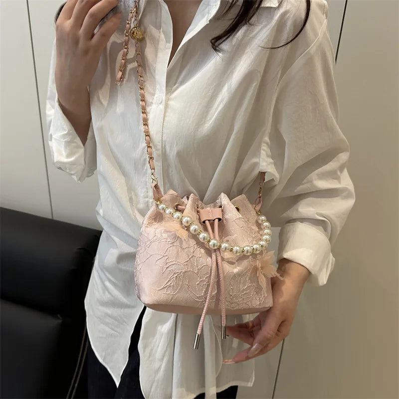 Women's butterfly bucket shoulder bag by MAIRA'S COLLECTIONS featuring a stylish butterfly design and adjustable shoulder strap.