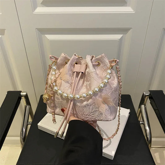 Women's butterfly bucket shoulder bag by MAIRA'S COLLECTIONS featuring a stylish design and adjustable shoulder strap.