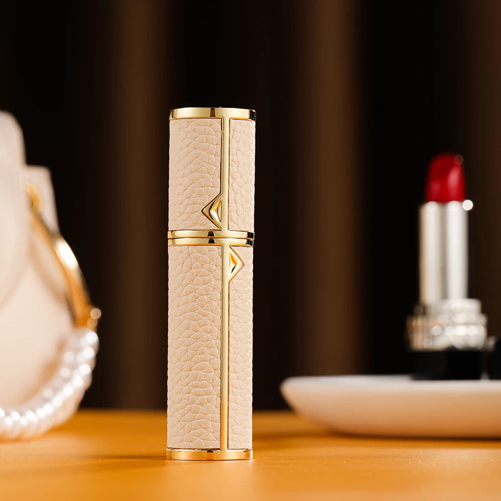 MAIRA'S COLLECTIONS Louischanzl refillable perfume atomizer bottle, 5ml travel spray with sleek design and transparent container.