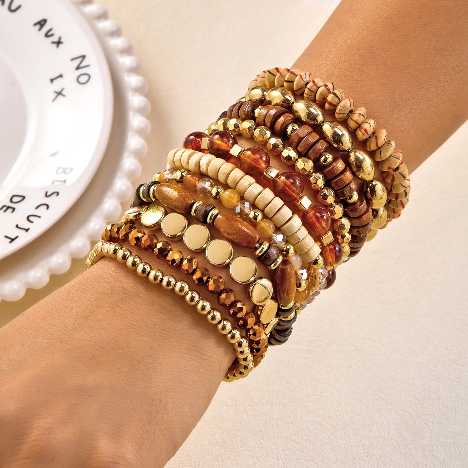 Set of 10 bohemian wood beaded bracelets from MAIRA'S COLLECTIONS with natural wooden and beaded designs.