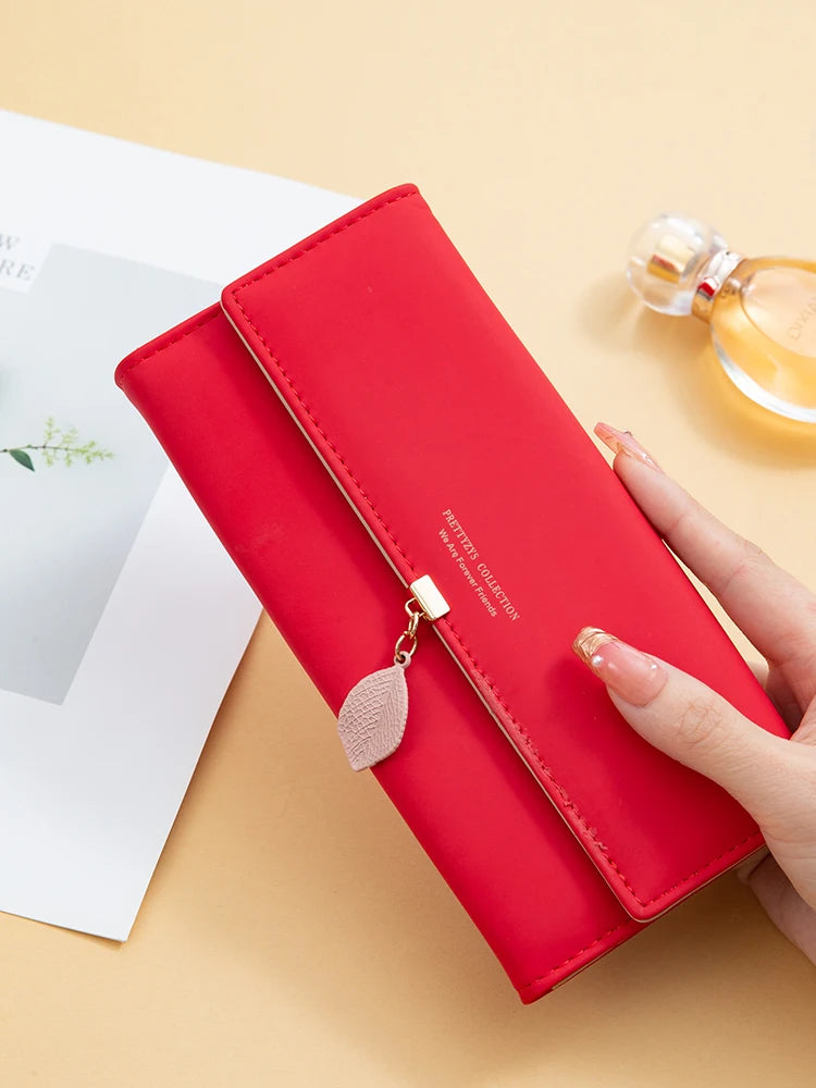 Women's PU leather tri-fold bag from MAIRA'S COLLECTIONS with multiple compartments and stylish design, shown in the image.
