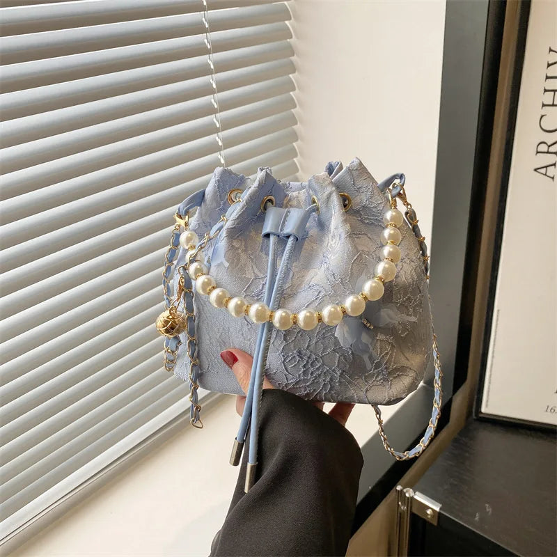 Women's butterfly bucket shoulder bag by MAIRA'S COLLECTIONS featuring a stylish design and adjustable strap.