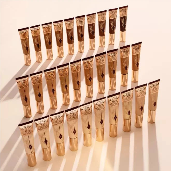 MAIRA'S COLLECTIONS CT Starlight Liquid Flawless Glow Primer in a sleek bottle with a shimmering finish.