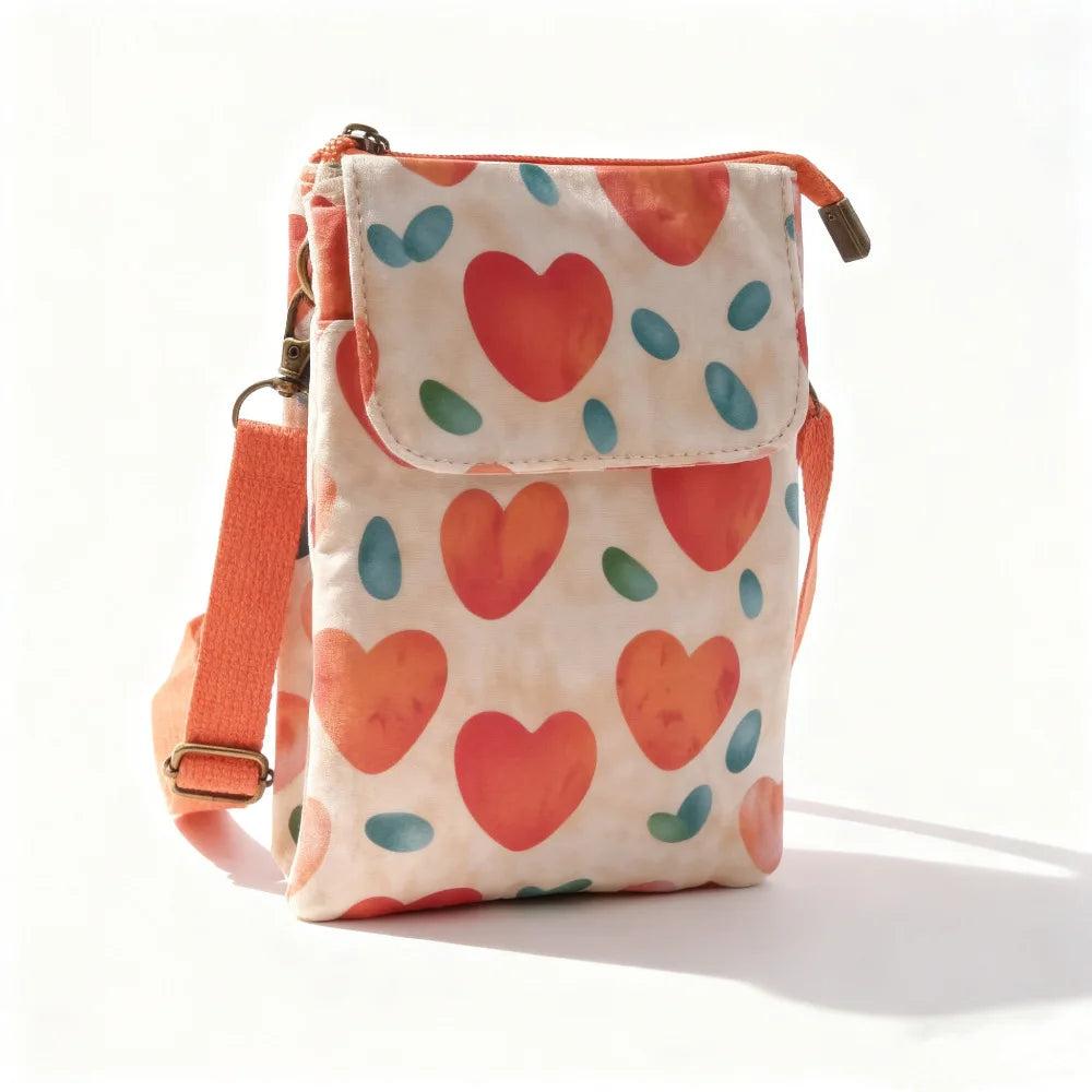 Women's printed crossbody phone bag by MAIRA'S COLLECTIONS with colorful floral pattern and adjustable strap.