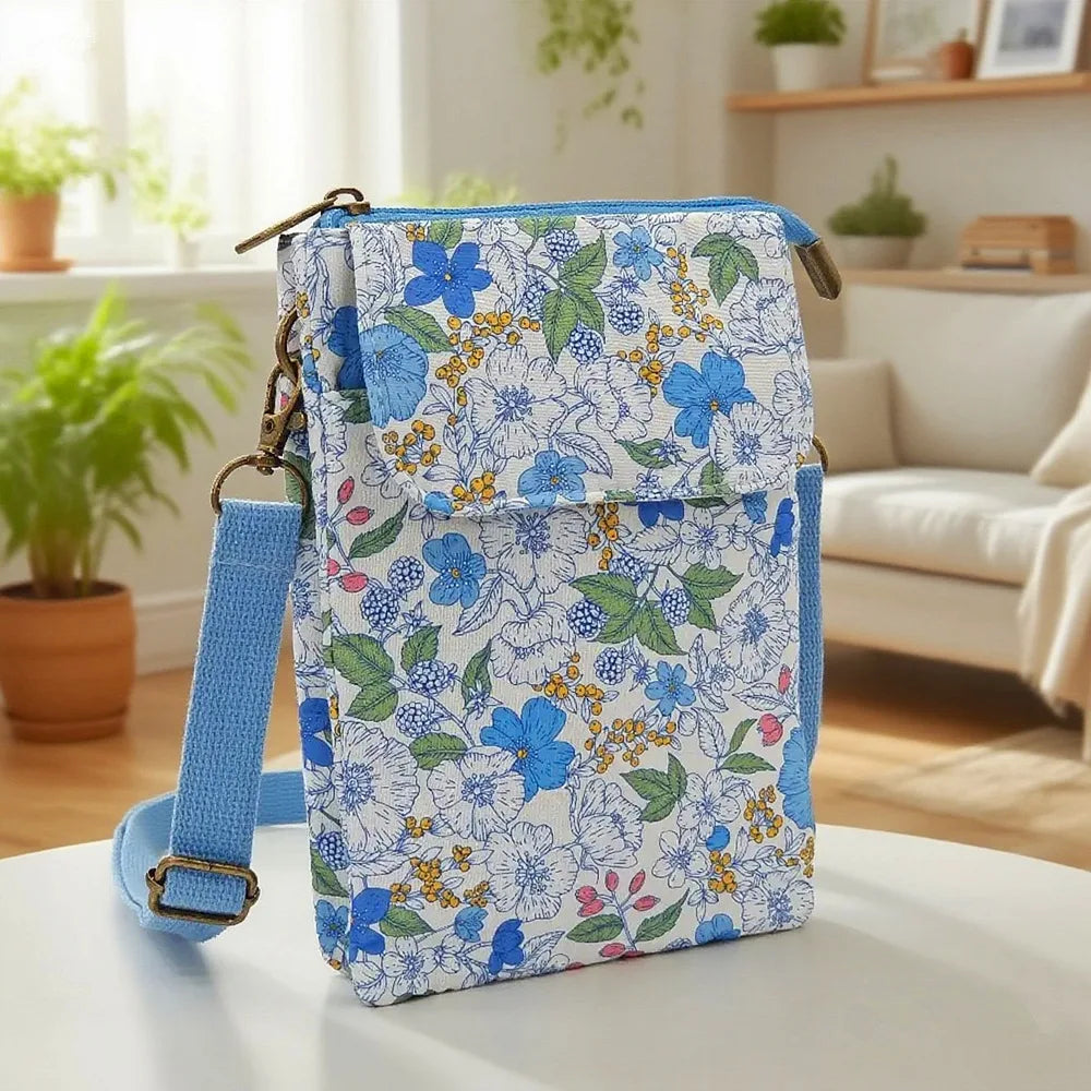 Women's printed crossbody phone bag in vibrant design from MAIRA'S COLLECTIONS, featuring adjustable strap and compact size.