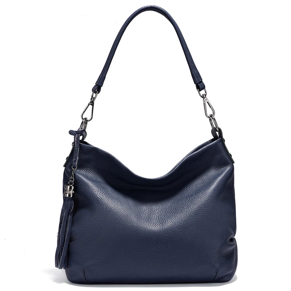 Zency cowhide leather shoulder bag by MAIRA'S COLLECTIONS with adjustable strap and sleek design visible in the image.