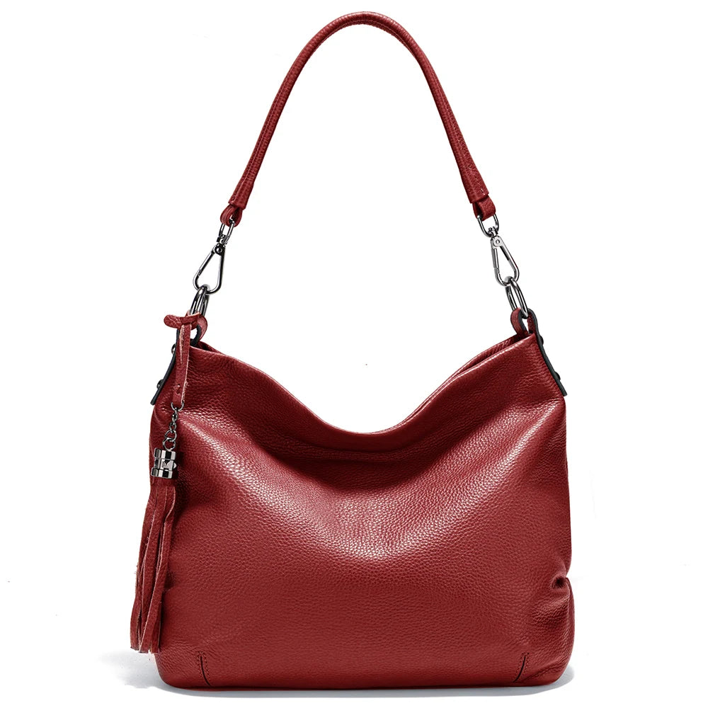 Zency cowhide leather shoulder bag from MAIRA'S COLLECTIONS showing a stylish tan leather design with shoulder strap and metal accents.
