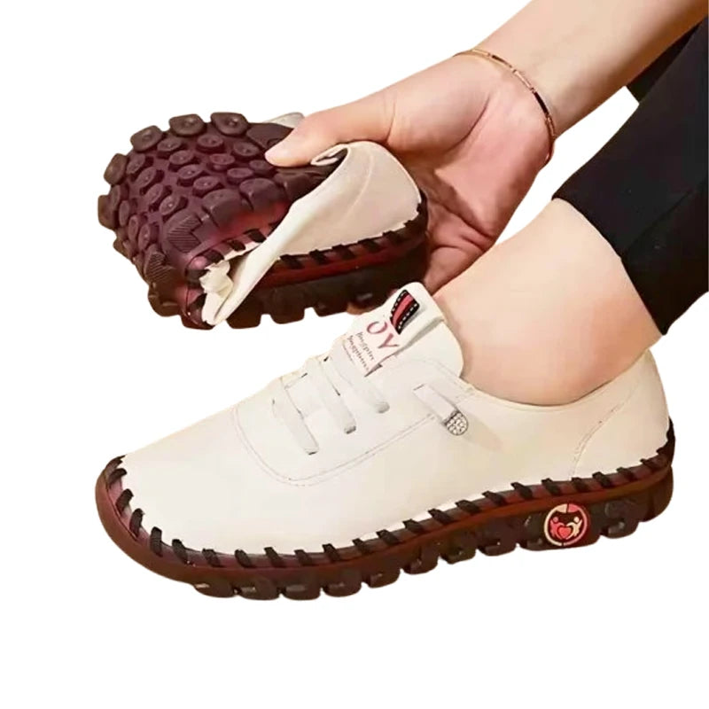 Women's leather sneakers by MAIRA'S COLLECTIONS, lace-up casual shoes in neutral tones with comfortable design and stylish detailing.