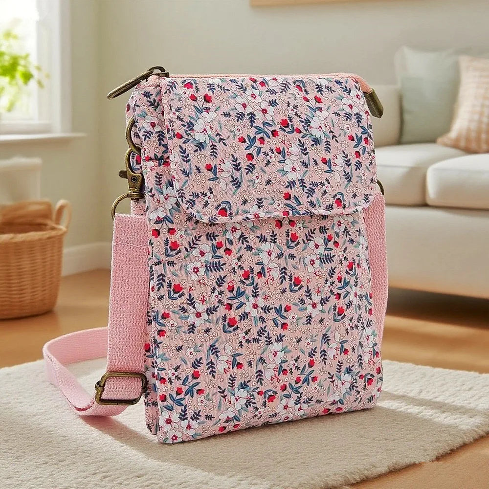 Women's printed crossbody phone bag by MAIRA'S COLLECTIONS featuring a colorful floral design and compact size for everyday use.