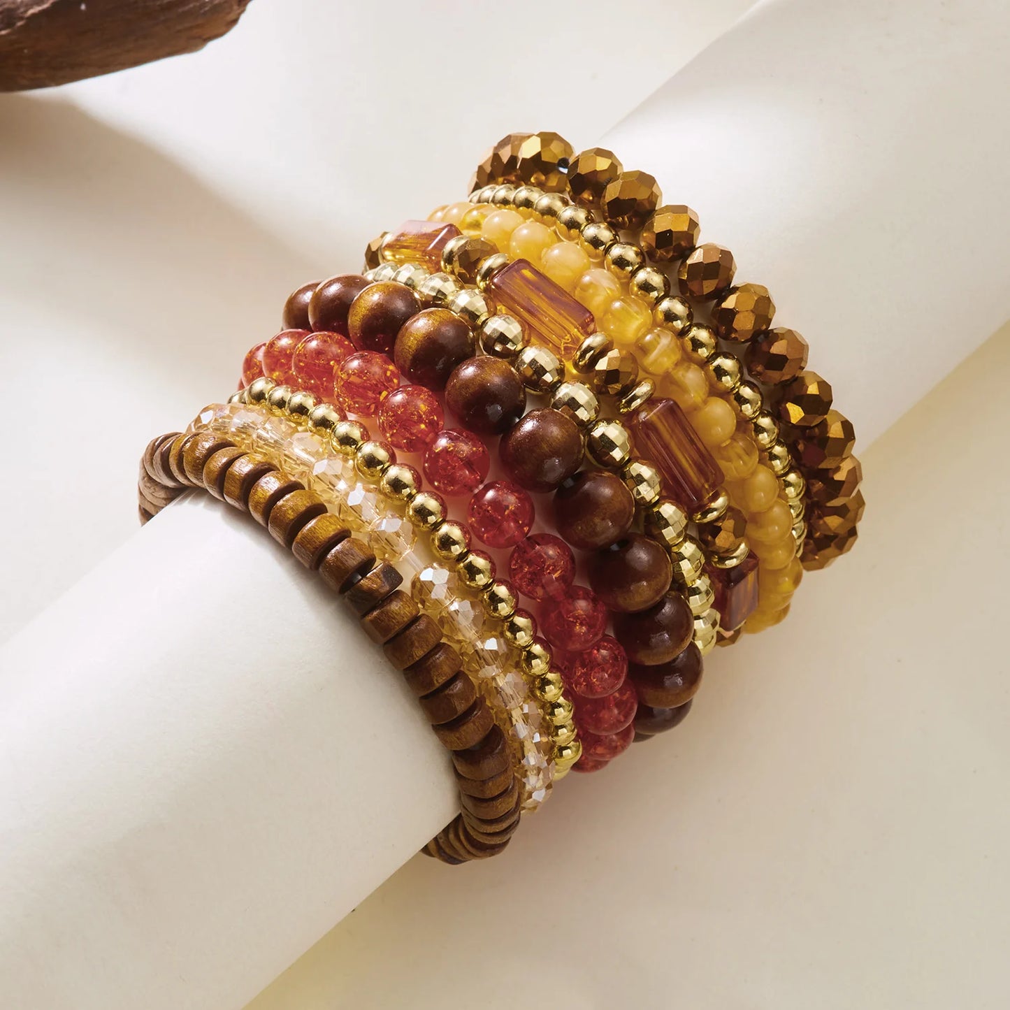 Set of 10 bohemian wood beaded bracelets from MAIRA'S COLLECTIONS, featuring natural wooden beads and stylish design.