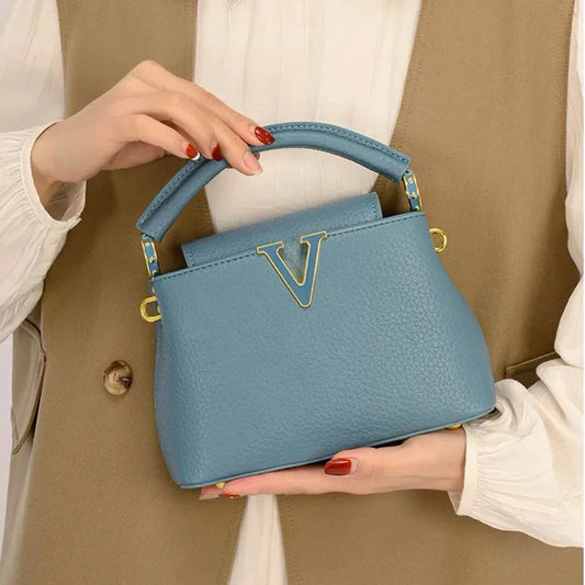 Women's luxury leather crossbody bag by MAIRA'S COLLECTIONS with sleek design and adjustable strap, shown in black leather.