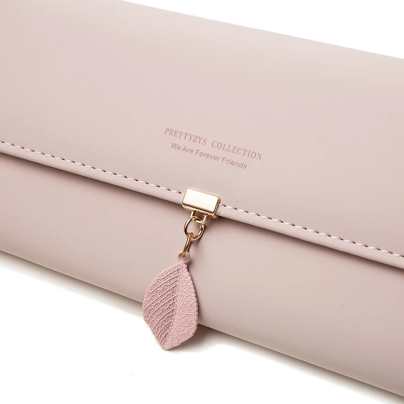 Women's PU leather tri-fold bag by MAIRA'S COLLECTIONS, showing its compact design and textured surface.