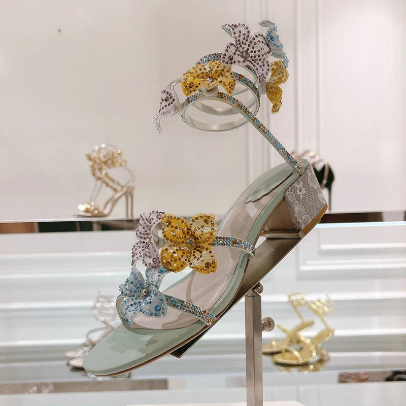 Women's rhinestone square heel sandals by MAIRA'S COLLECTIONS with sparkling embellishments and open-toe design.