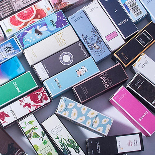 Q Style Pheromone Perfume Set by MAIRA'S COLLECTIONS with five 3ml bottles, showcasing sleek perfume packaging.