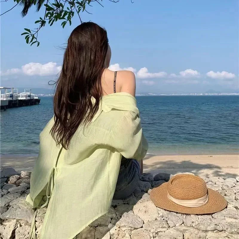 Women's lace-up beach blouse by MAIRA'S COLLECTIONS featuring lightweight fabric and stylish design, shown on a hanger.