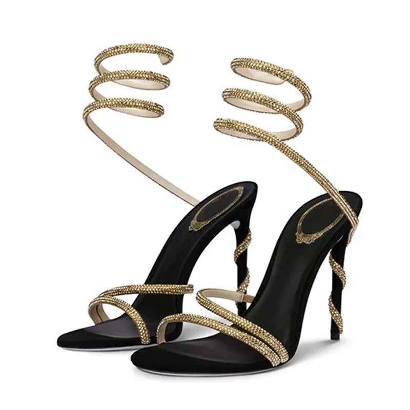 Eilyken Crystal Ankle Strap High Heel Sandals by MAIRA'S COLLECTIONS with sparkling crystal details and slender heel.