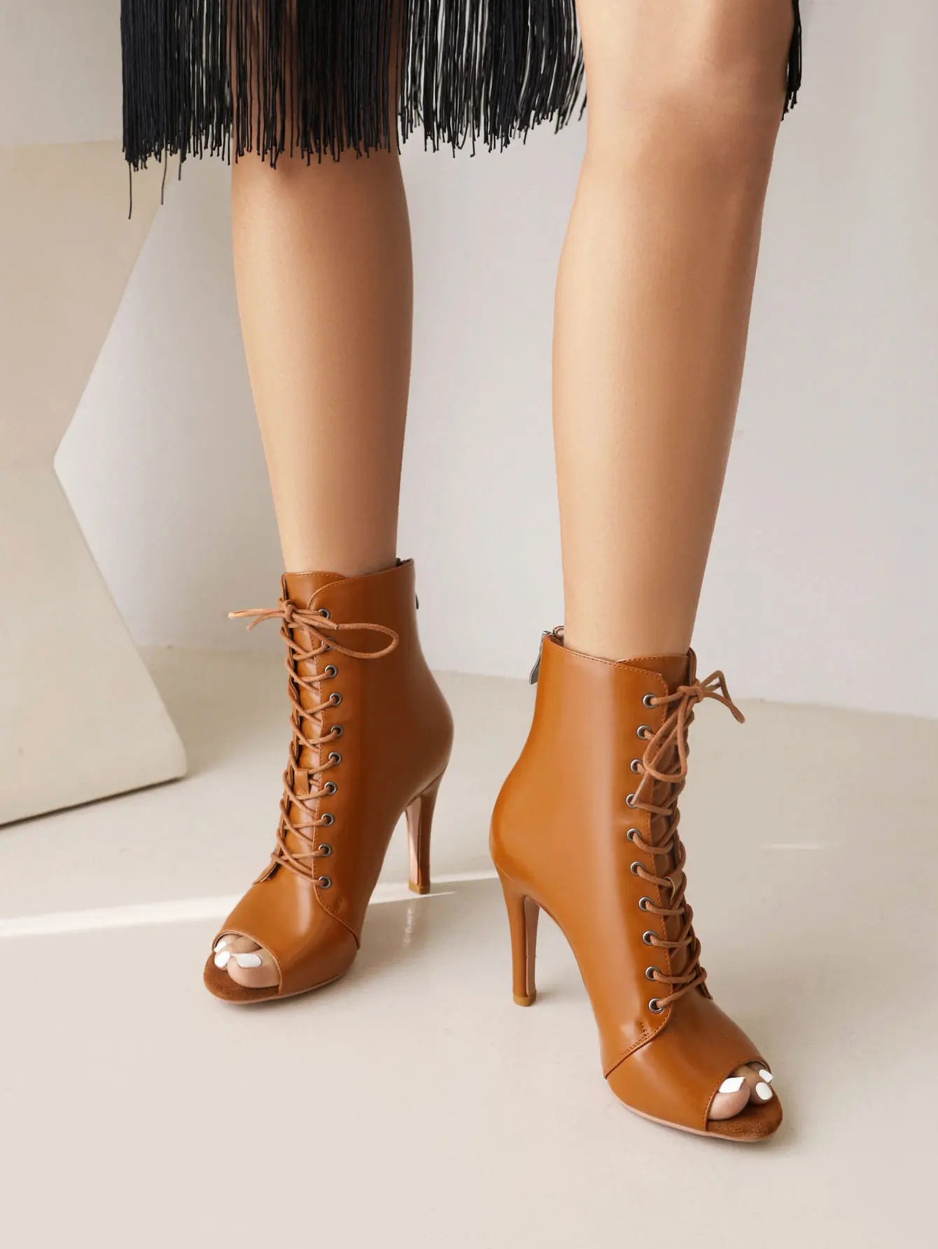 Women's stiletto high heels from MAIRA'S COLLECTIONS, elegant ballroom and party dance shoes with sleek black design.