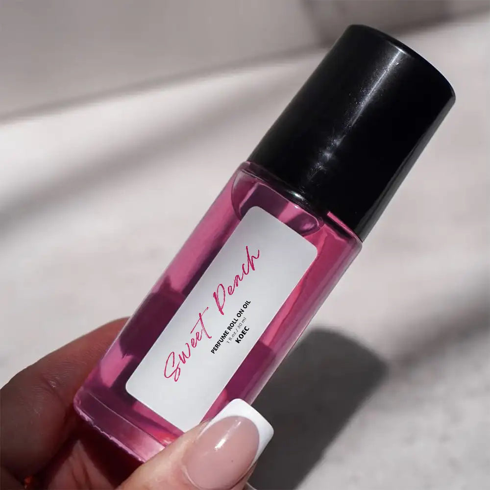 MAIRA'S COLLECTIONS 30ml Sweet Peach fragrance roll-on oil with jasmine and musk, nourishing and long-lasting natural scent in a portable bottle.