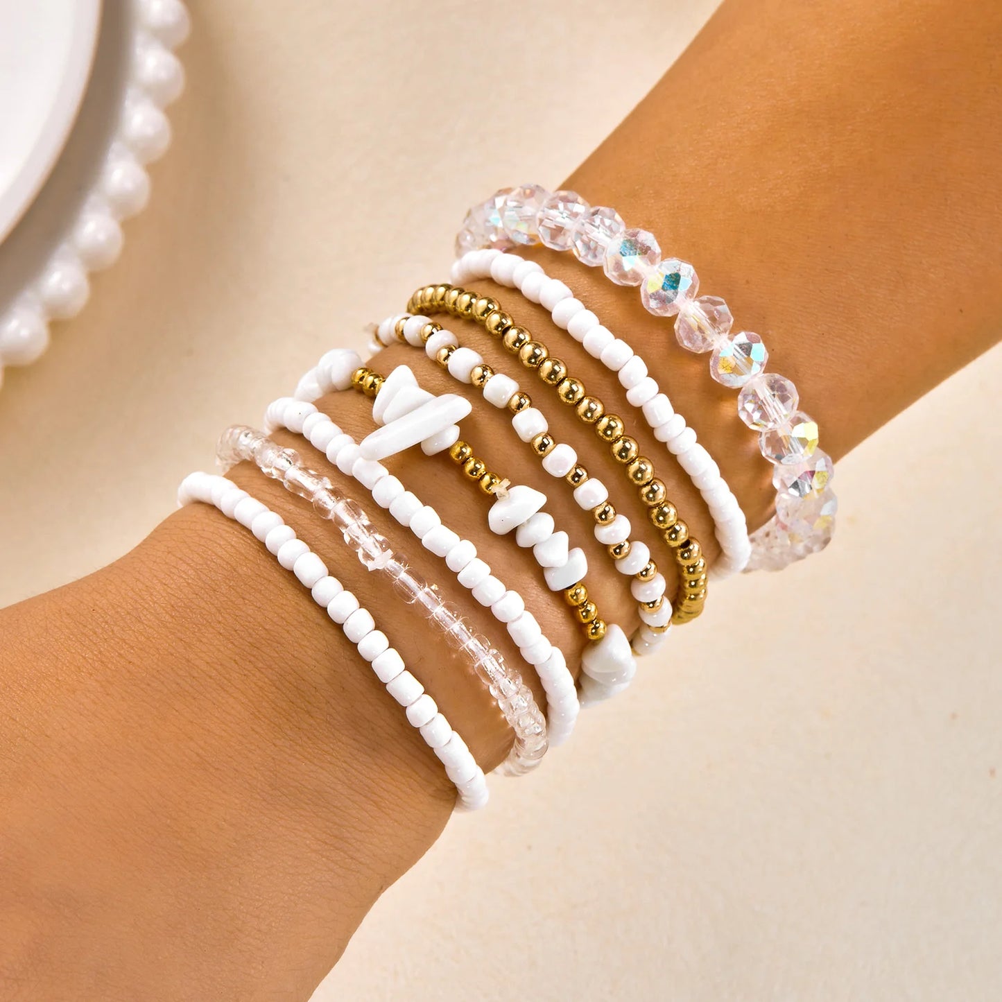 Set of 10 bohemian wood beaded bracelets from MAIRA'S COLLECTIONS with natural wooden beads and adjustable designs.