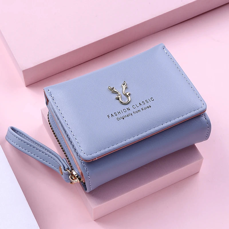 Women's PU leather mini wallet by MAIRA'S COLLECTIONS featuring compact design and card slots in black.