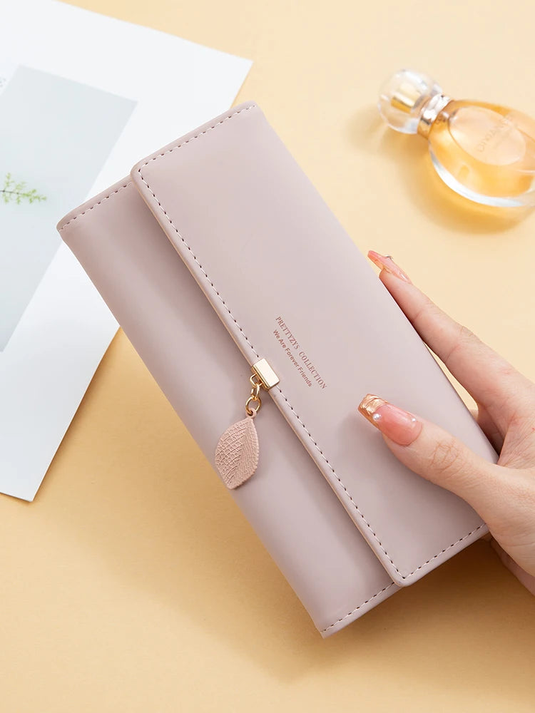 Women's PU leather tri-fold bag by MAIRA'S COLLECTIONS with multiple compartments and stylish design.