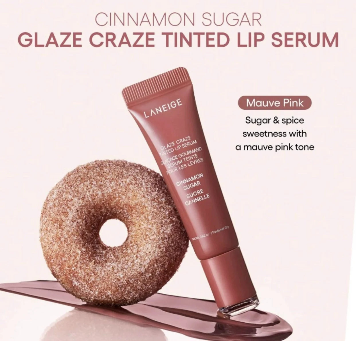 MAIRA'S COLLECTIONS Donut Lip Oil with strawberry, raspberry, and chocolate scent, featuring a colorful donut-shaped lip balm on a white background.