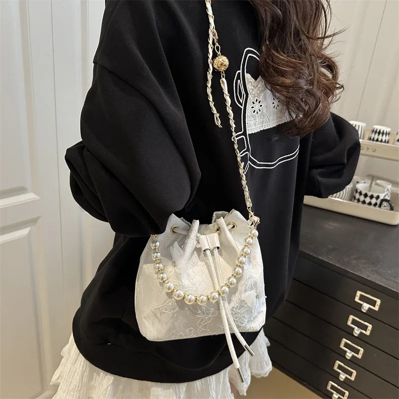 Women's butterfly bucket shoulder bag by MAIRA'S COLLECTIONS, featuring a stylish design with butterfly details and a shoulder strap.
