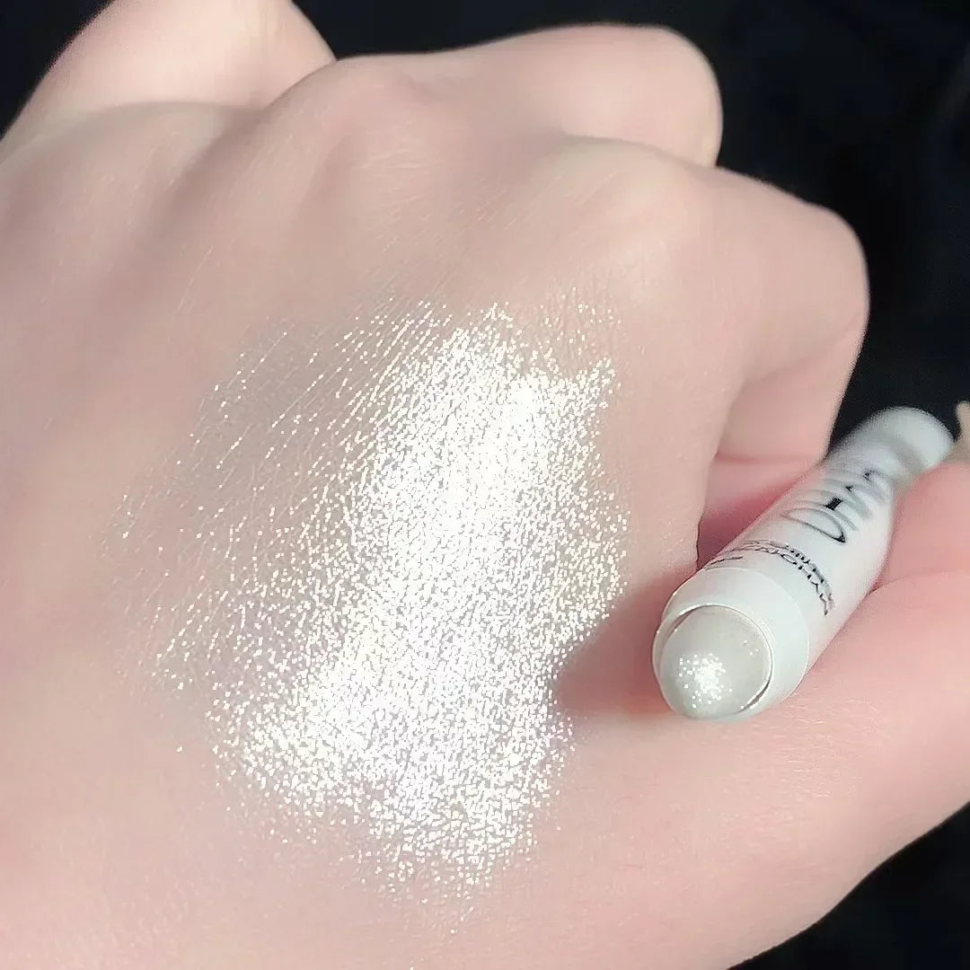 Pearlescent glitter eyeliner pen from MAIRA'S COLLECTIONS with brightening waterproof eye stick, shown with the pen and swatched on skin.