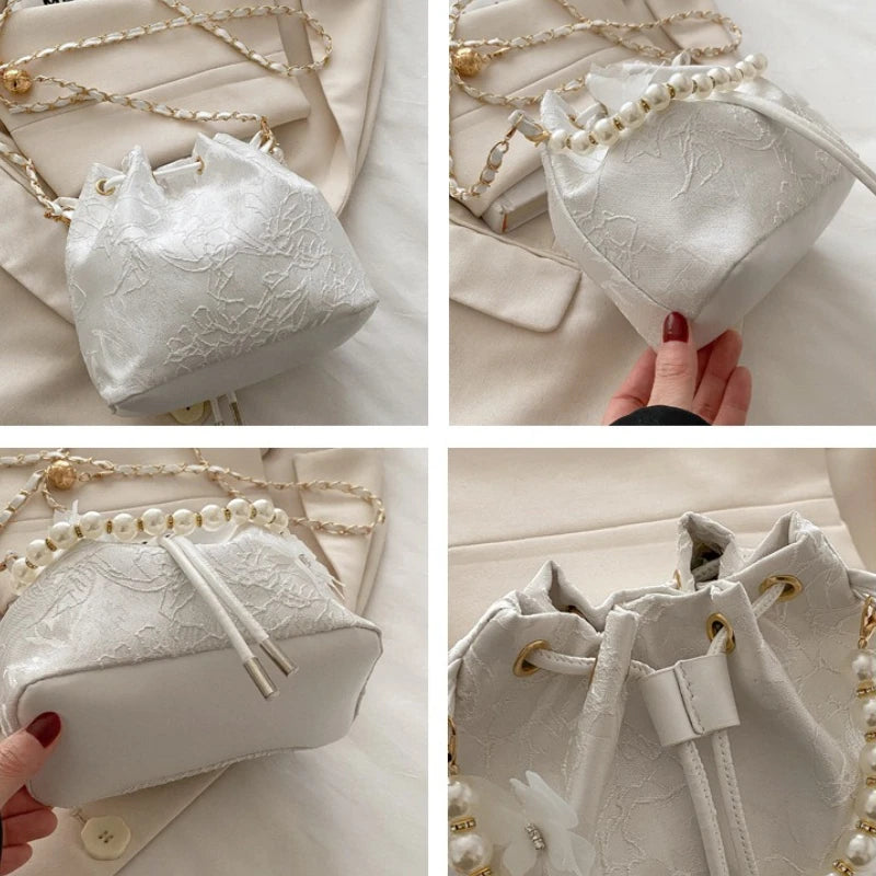 Women's butterfly-shaped bucket shoulder bag by MAIRA'S COLLECTIONS with adjustable strap and floral print.