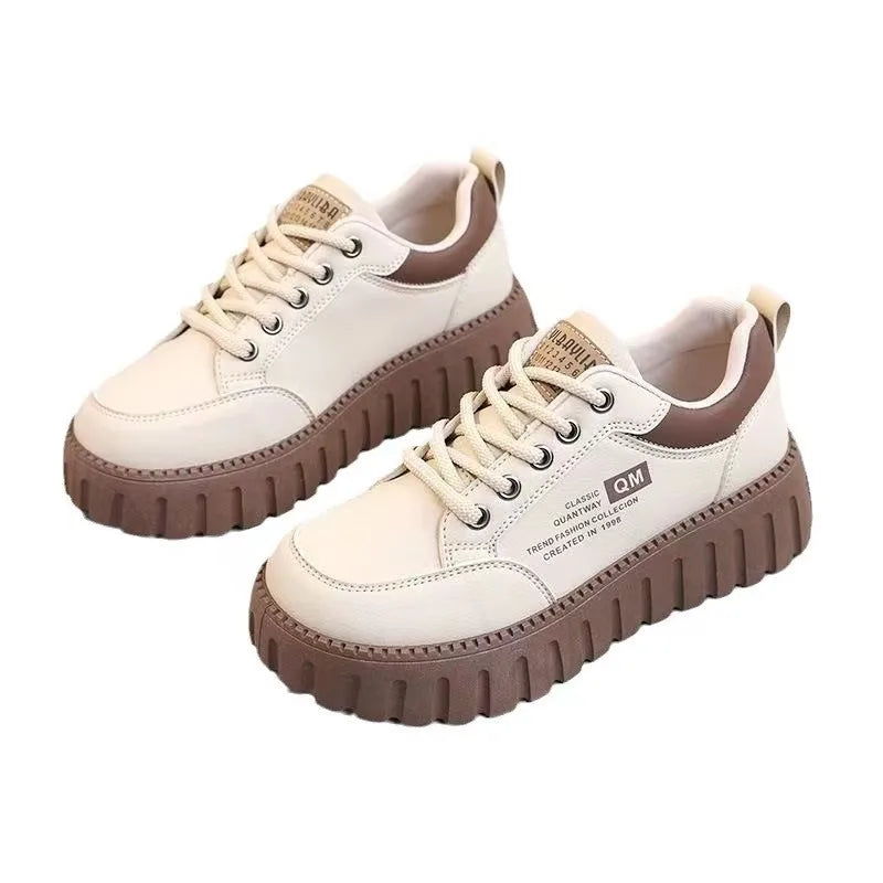 Women's white platform sneakers with thick soles from MAIRA'S COLLECTIONS, showing stylish casual shoes with lace-up design.