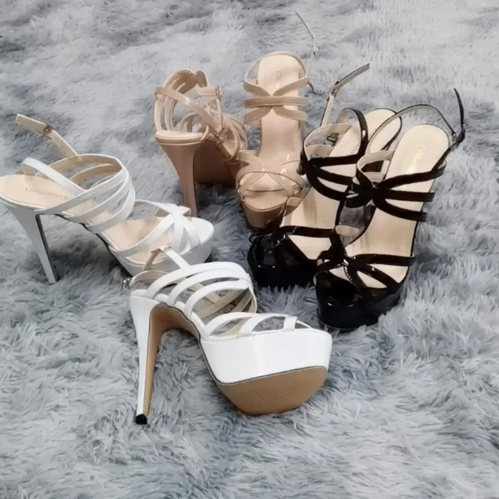 Women's 14cm platform high heel sandals with ankle straps from MAIRA'S COLLECTIONS, featuring sleek black pumps on a white background.