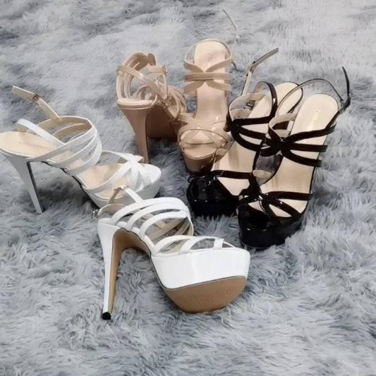 Women's 14cm platform high heel sandals with ankle straps from MAIRA'S COLLECTIONS, featuring sleek black pumps on a white background.
