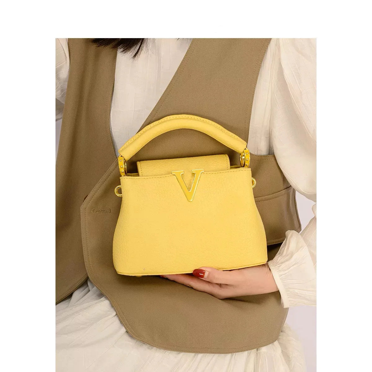 Women's luxury leather crossbody bag by MAIRA'S COLLECTIONS featuring sleek design and adjustable strap.