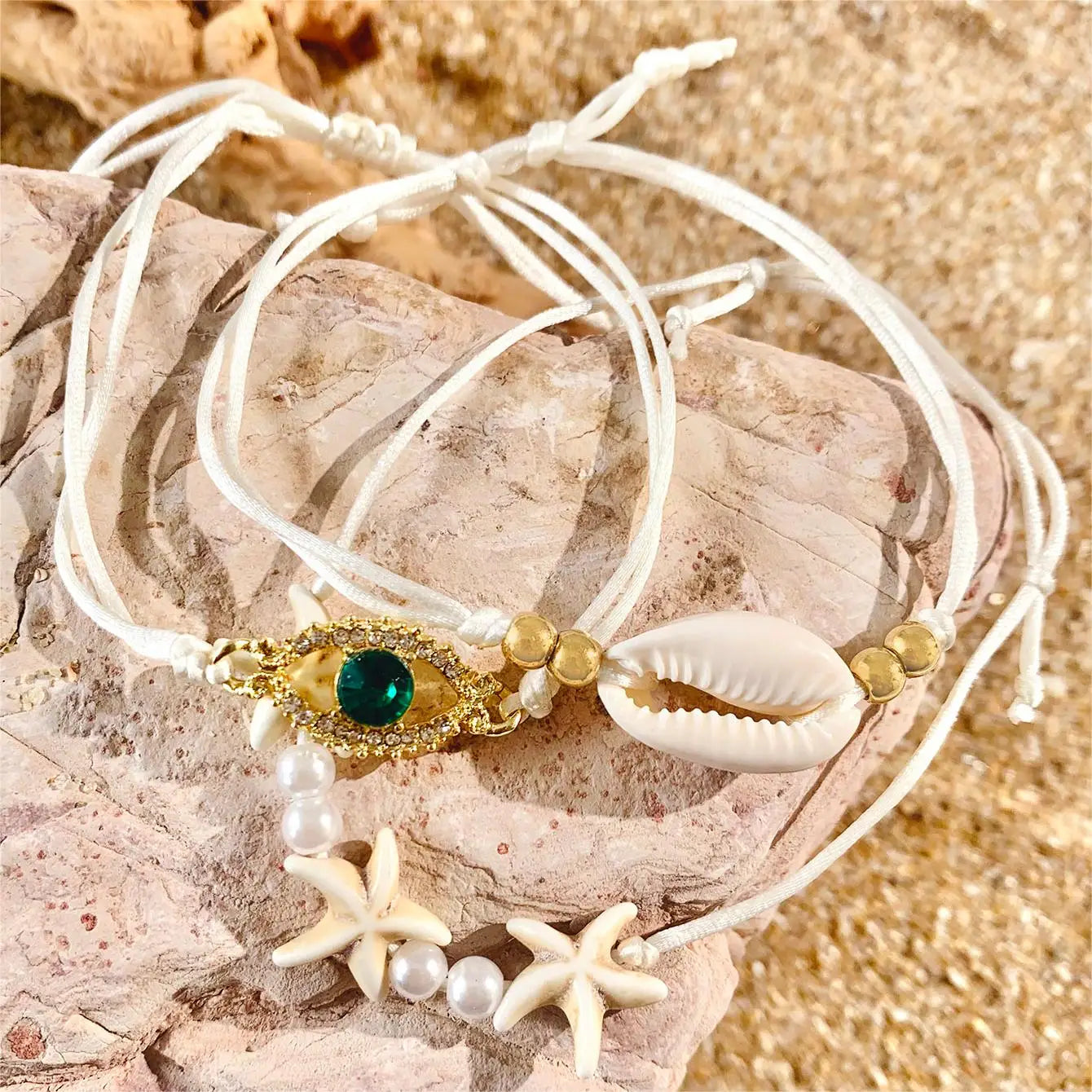 Set of five bohemian pearl bracelets by MAIRA'S COLLECTIONS featuring mixed pearl designs and adjustable cords.