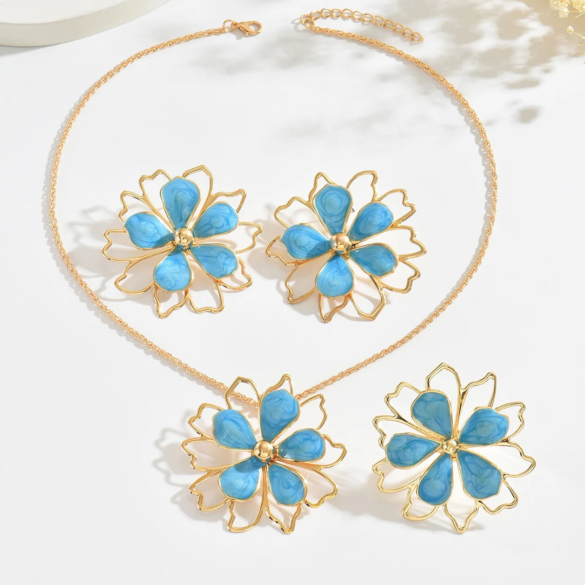 Bohemian floral jewelry set by MAIRA'S COLLECTIONS featuring colorful floral earrings and necklace with intricate design.
