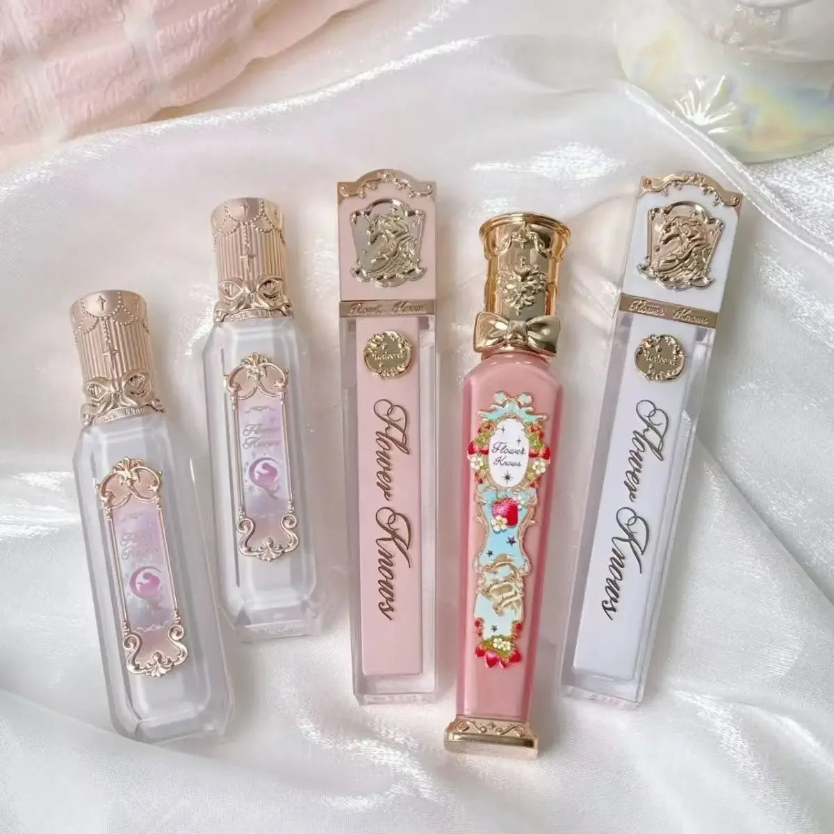 MAIRA'S COLLECTIONS Flower Knows Strawberry Rococo Lip Cream in a sleek tube, showcasing its vibrant strawberry color.