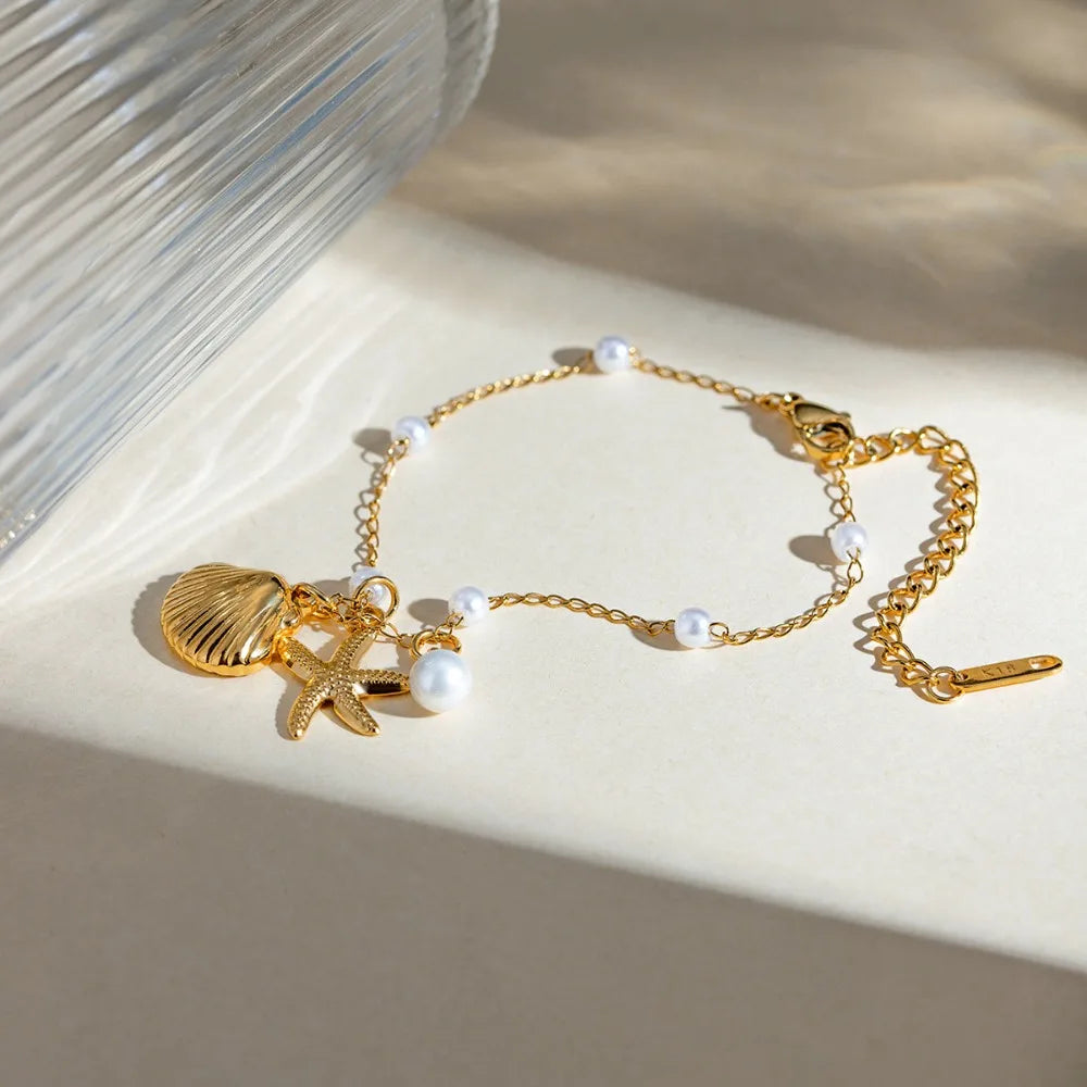 Bohemian starfish shell pearl bracelet by MAIRA'S COLLECTIONS featuring starfish charms, white pearls, and boho style design.