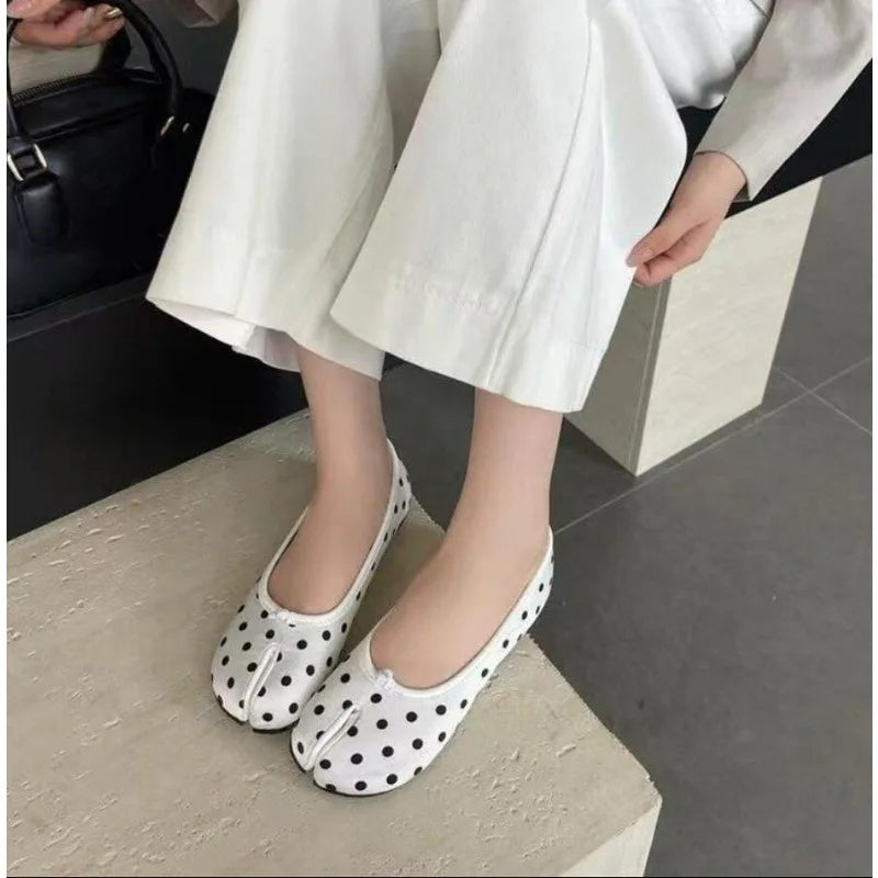 Women's polka dot Tabi flats by MAIRA'S COLLECTIONS featuring split toe ballerina shoe design with black and white polka dots.