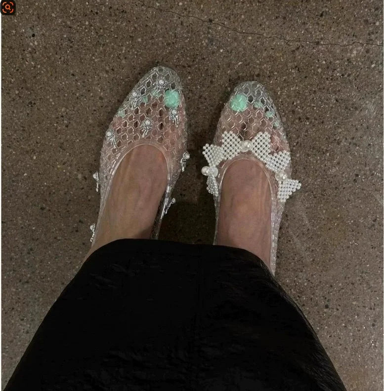 Women's crystal jelly flats with pointed toe design, summer sandals from MAIRA'S COLLECTIONS, featuring transparent jelly material and elegant style.