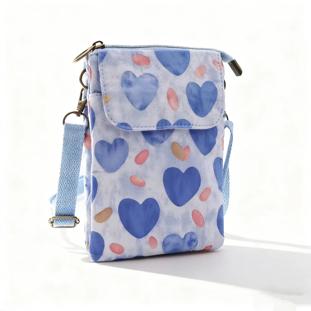 Women's printed crossbody phone bag by MAIRA'S COLLECTIONS, showing a stylish bag with colorful floral print and adjustable strap.