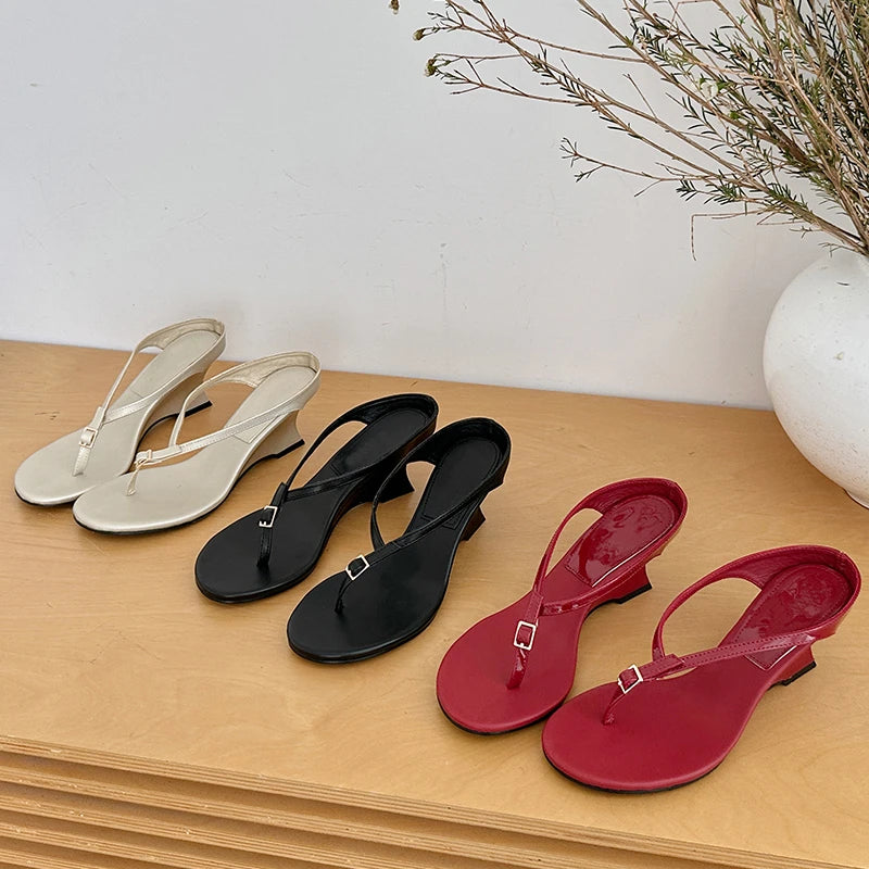 Eilyken Women's Buckle Wedge Sandals featuring brown leather straps and a sturdy wedge heel, stylish and comfortable for summer wear.