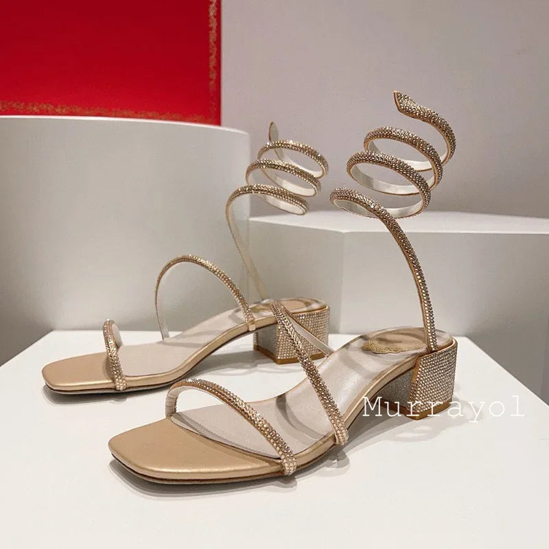 Women's rhinestone square heel sandals with elastic ankle strap by MAIRA'S COLLECTIONS, showcasing stylish footwear with sparkling details.